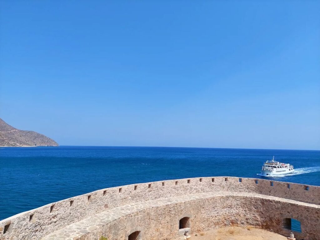 Boat arriving at Spinalonga Island. 