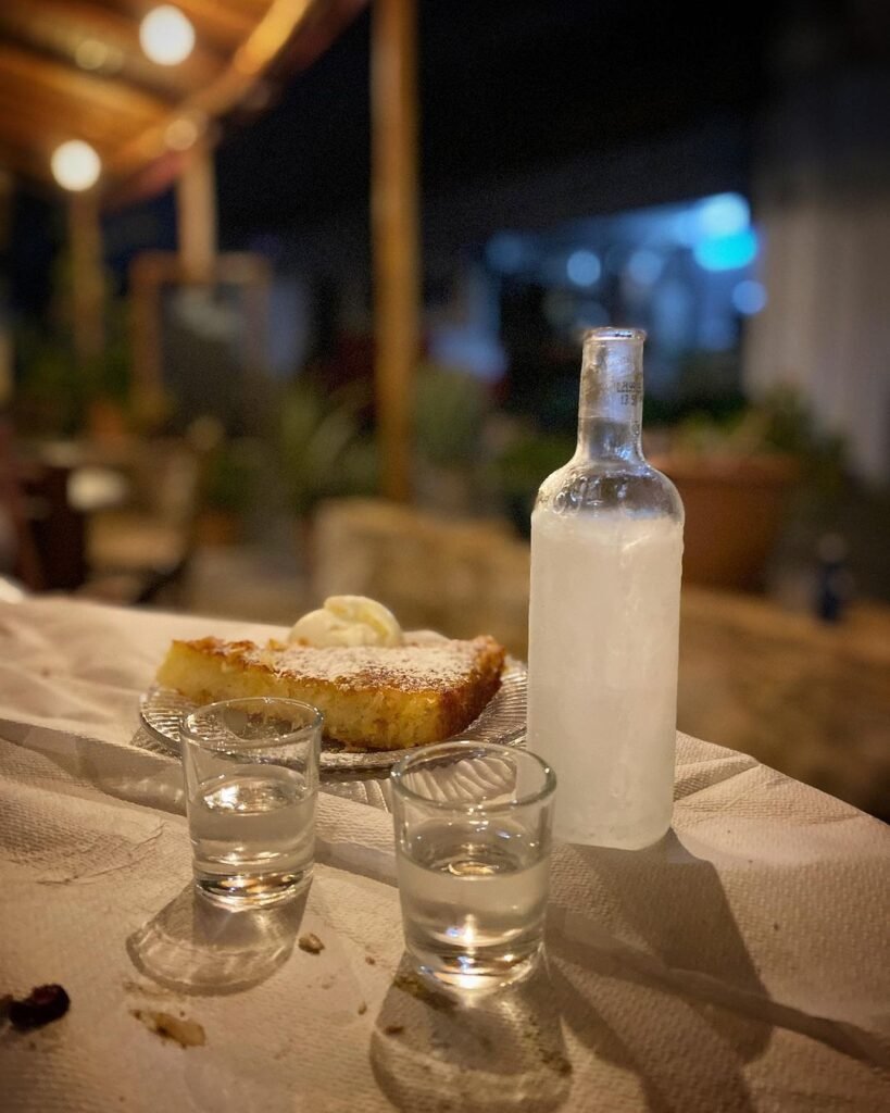 Cretan tsikoudia served with homemade dessert at Gavalianos Kafenes Monica's Taverna in Gavalochori. 