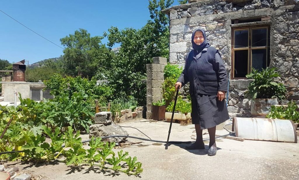 A smiling Cretan woman in Lasithi, Crete.