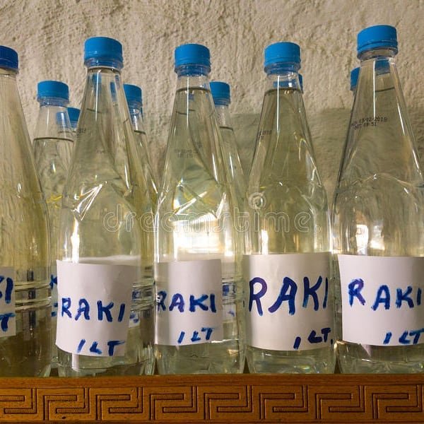 Cretan hospitality bottled: Homemade raki, the island's heart in humble plastic. 