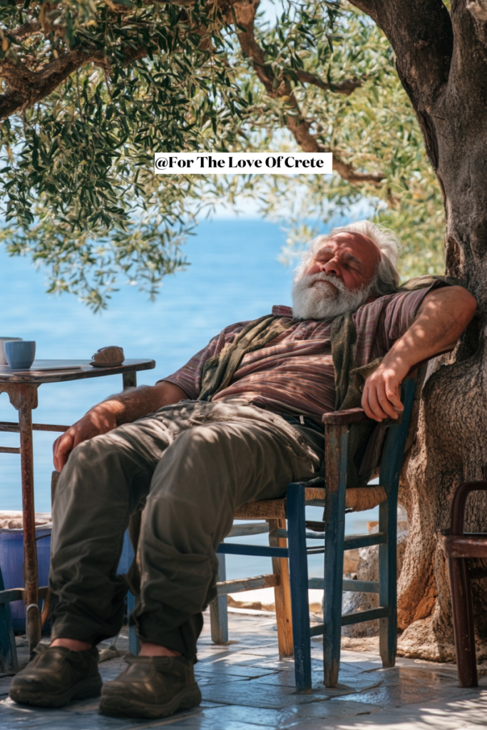 A Cretan man enjoying a siesta under the shade of olive trees in Crete, Greece.