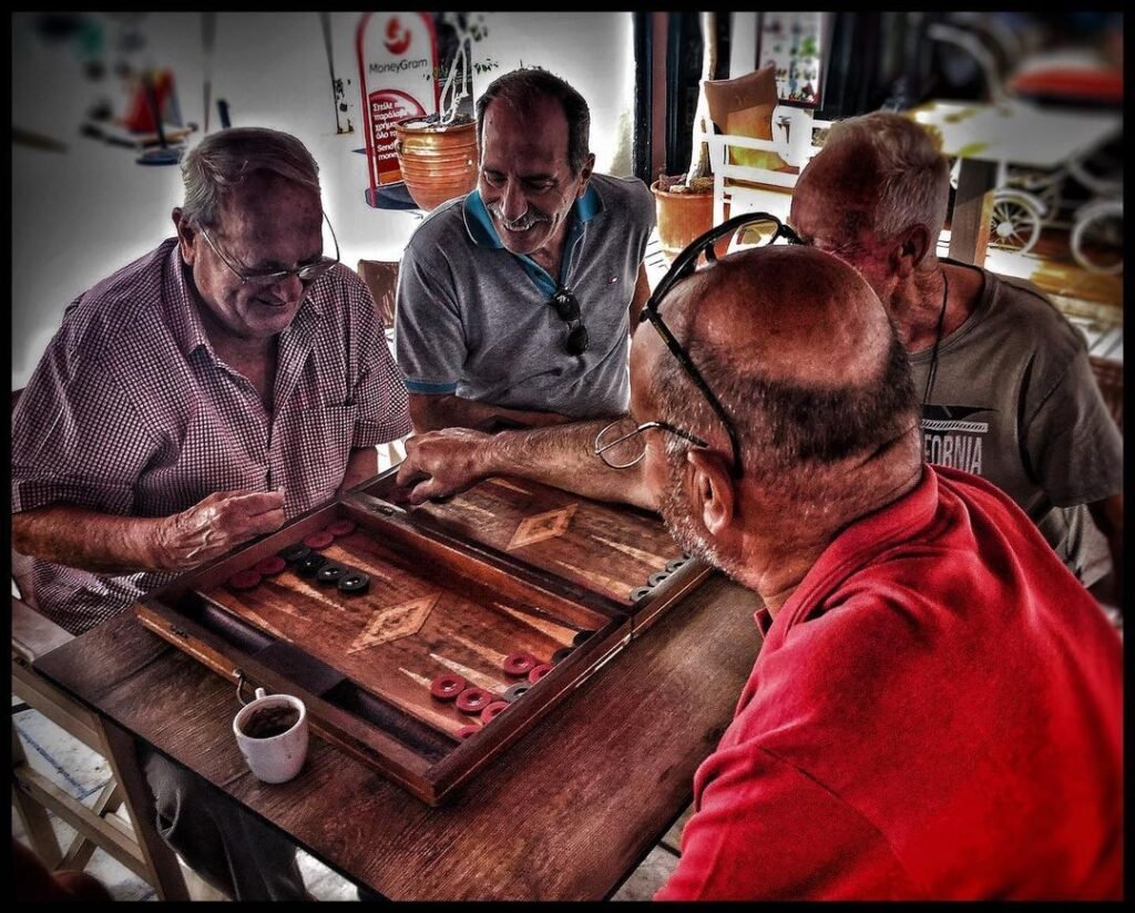 Cretan men playing Greek tavli (backgammon) in a taverna. 