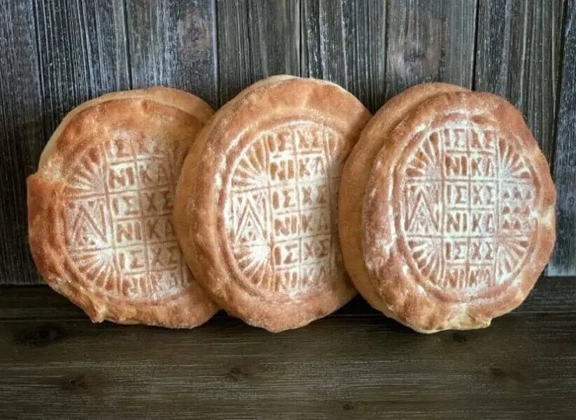 Artos: Sacred ceremonial bread, adorned with Orthodox symbols and infused with aromatic spices, crafted for feast days and religious celebrations. 