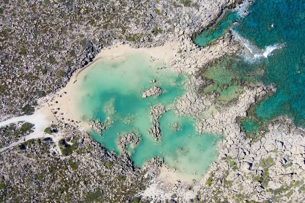 Aspra Limni (White Lake) with its stretch of white sand. 