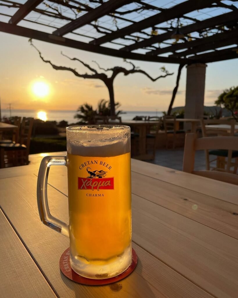 Savoring a Charma beer while watching a spectacular sunset at Falassarna, Kissamos, Crete. 