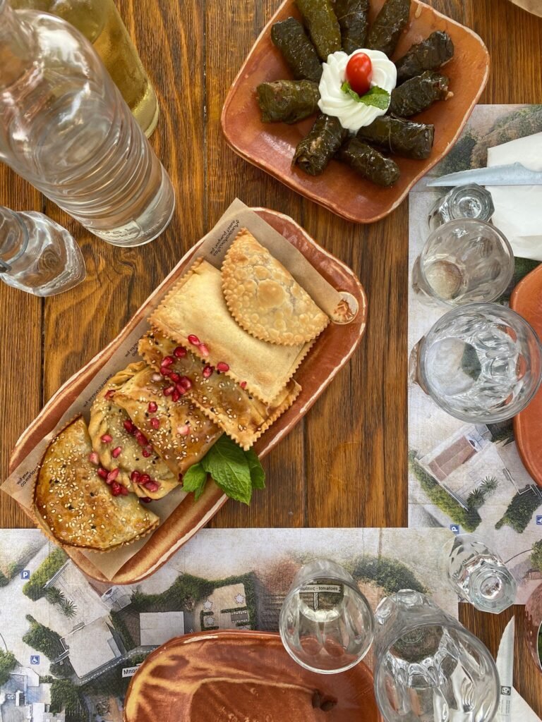 A taste of Crete: Cretan Kalitsounia and Dolmadakia (stuffed vine leaves) served at Gramvousa Restaurant in Kissamos, Crete. 