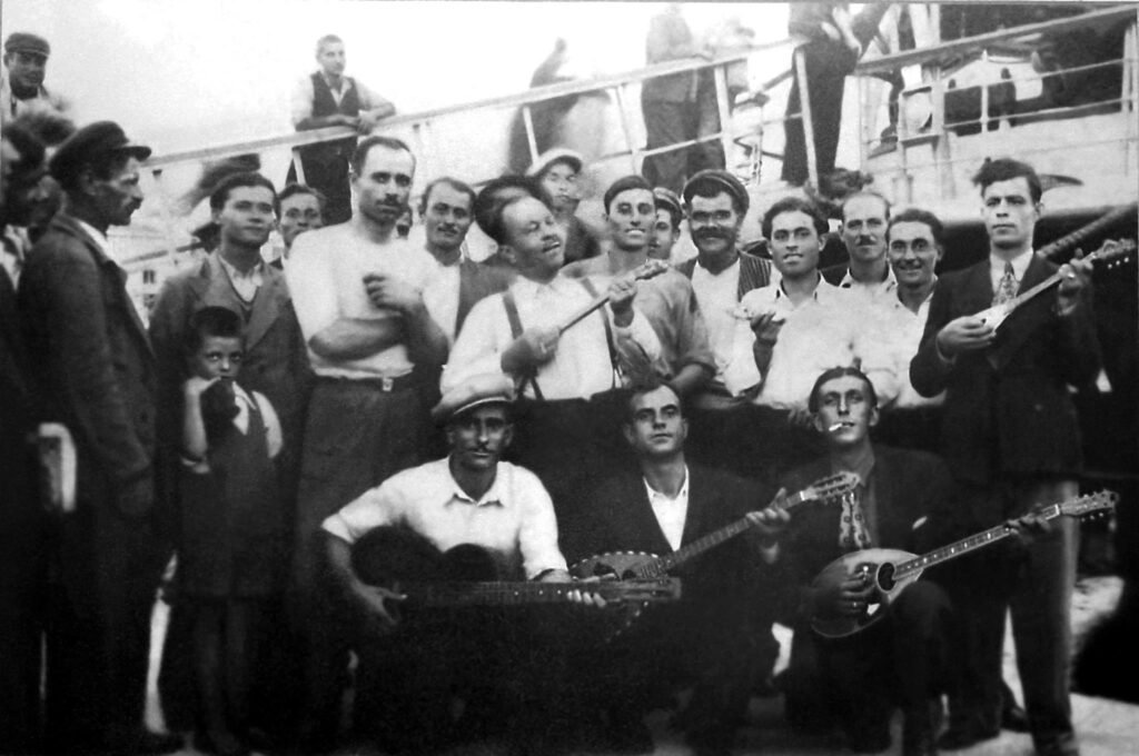 A glimpse into the golden era of Rebetiko, capturing the spirit of the 1920s/1930s, where the heartfelt melodies of bouzoukis and baglamas echoed the struggles and stories of the people. 