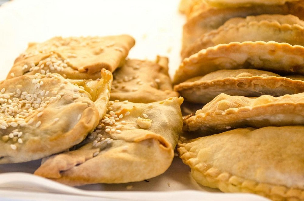 Fresh pastries, such as Cretan kalitsounia, available daily at To Artopoleion Bakery in Chania, Crete. 