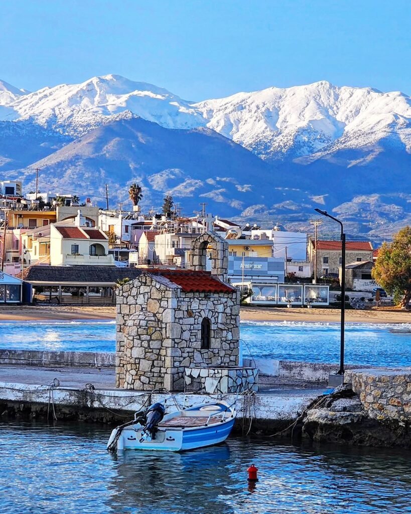 A beautiful shot of Kalives harbor taken on 31st December, 2024, Lefka Ori peaks with snow