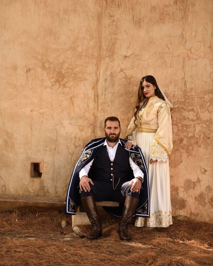 Where tradition meets timeless elegance—this Cretan newlywed couple embodies the enduring spirit of the island, wearing attire that bridges the past with the present. 