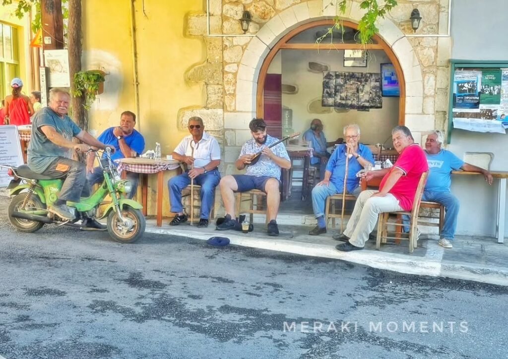 A timeless moment at the village kafeneion in Gavalochori, where conversation flows and a Cretan lyra adds to the spirit of tradition. 