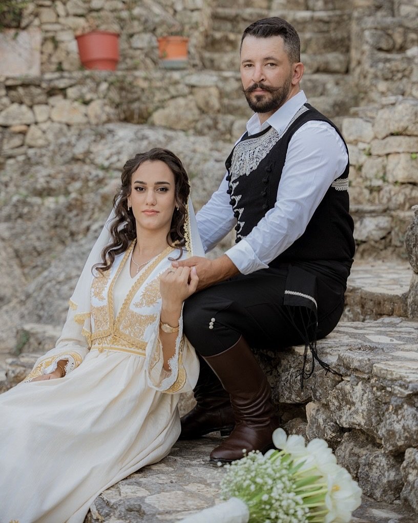 Dressed in the timeless elegance of Cretan tradition. A couple celebrating their engagement in beautifully embroidered Cretan attire, honoring heritage and love.