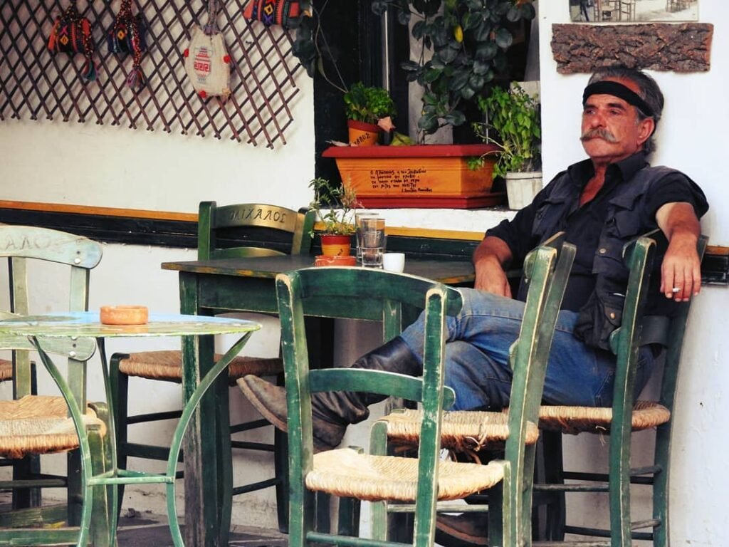 A Cretan elder in Anogeia, Rethymno, Crete—embodying the island's authentic mountain culture where directness, honor, and adherence to long-standing customs remain central to daily life.