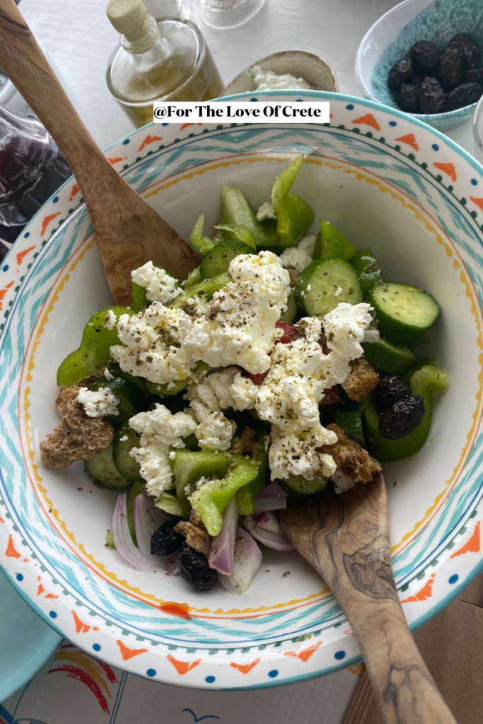 A twist on the classic Horiatiki, Crete’s village salad brings together crisp vegetables, local myzithra cheese, and barley rusks, all drizzled with olive oil.