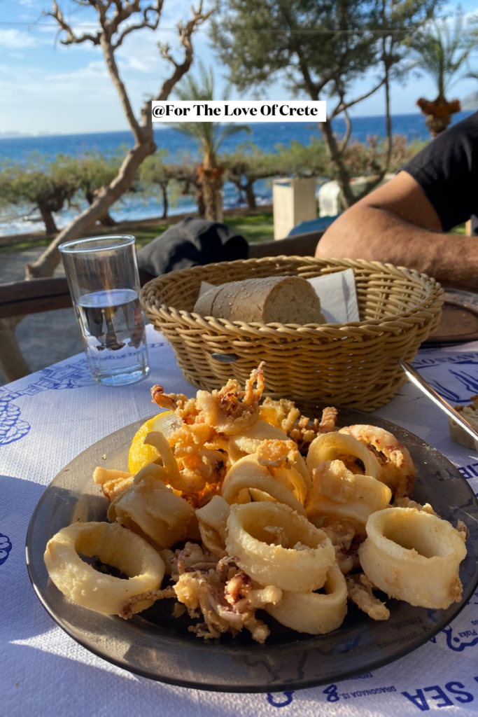 Crispy and golden, this freshly fried calamari is a must-try at any coastal taverna, served simply with lemon and a side of garlic dip.