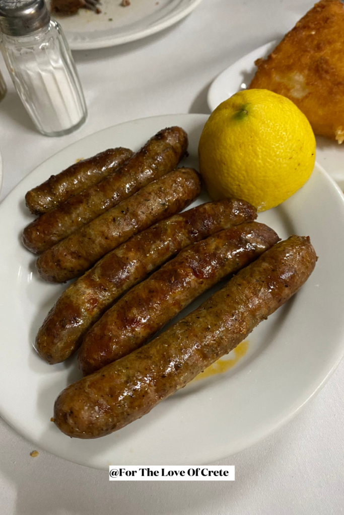 Seasoned with wild herbs and spices, these traditional Greek sausages are slowly cured and grilled over charcoal, offering a smoky, aromatic bite.