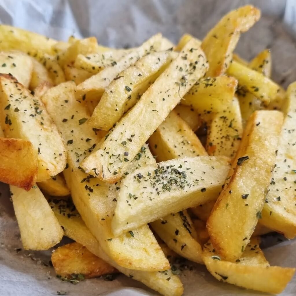 There can never be a proper Greek mezedes spread without a plate of hand-cut fried potatoes. Crispy on the outside, fluffy on the inside, and fried to golden perfection in Cretan olive oil, they’re finished with a sprinkle of sea salt and oregano for the ultimate comfort bite.