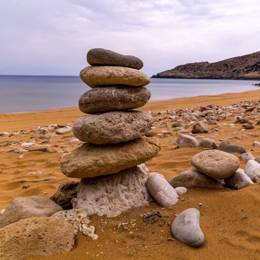 Natural sculptures on the red sands of Potamos Beach remind visitors that even the simplest moments on Gavdos can feel sacred. 