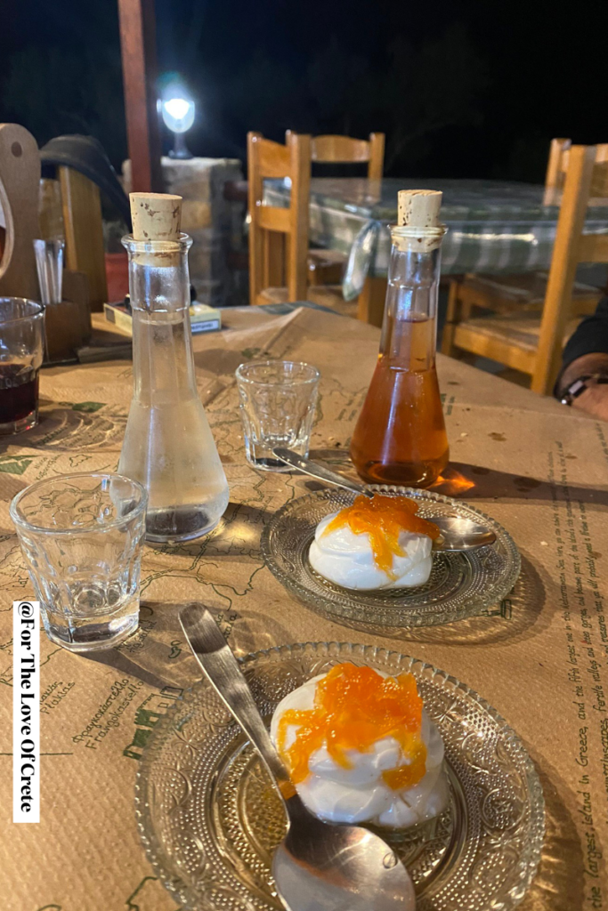 The traditional end-of-meal offering of raki and yogurt topped with spoon sweets—a gesture of Cretan hospitality that should always be graciously accepted, even if just for a small taste.