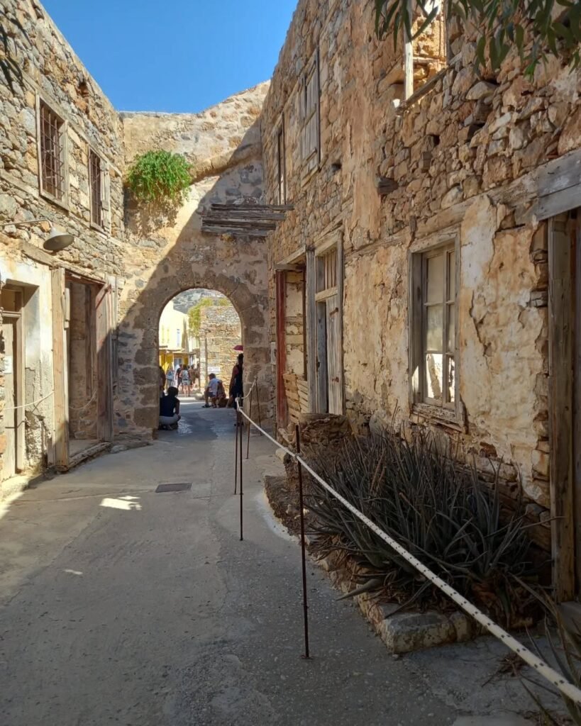 Walking through the hauntingly beautiful ruins of Spinalonga Island, where weathered stone walls whisper stories of resilience, exile, and humanity.