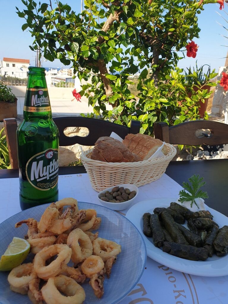 The perfect Cretan lunch at Areston Taverna in Hersonissos serves up golden calamari, dolmades, and a cold Mythos to complete the moment.