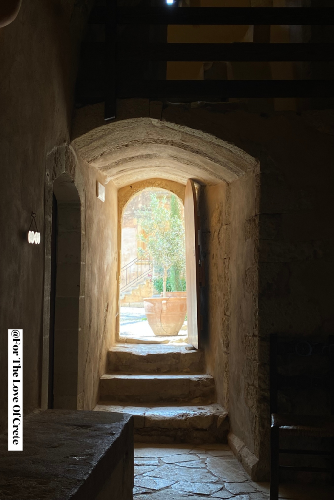 A quiet passageway inside Arkadi Monastery, where visitors can explore at their own pace and reflect on its powerful history.