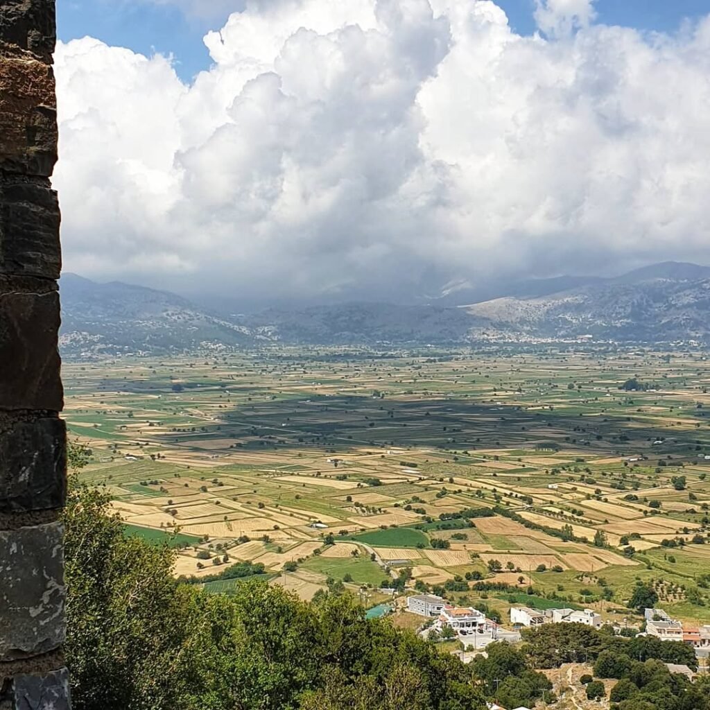 View from Dikteon Cave (also known as Dictaean or Psychro Cave), overlooking the fertile Lasithi Plateau in eastern Crete. Believed to be the mythical birthplace of Zeus, the cave is set to reopen in 2025 after major restoration works, with a new entrance fee of €15. 