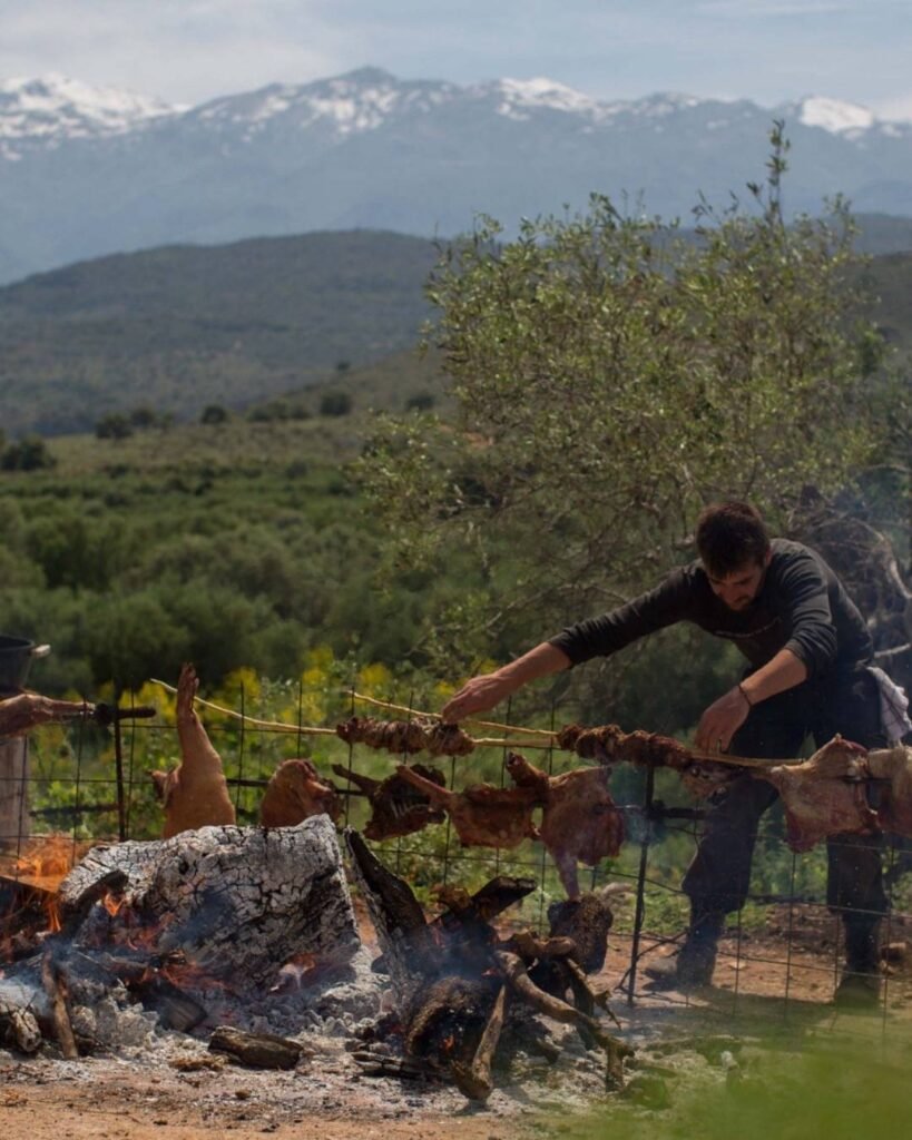 Spit-roasted lamb over an open fire—a timeless centerpiece of Orthodox Easter in Crete. As dawn breaks, families across the island prepare for the feast, blending flavor, tradition, and togetherness in every bite. 