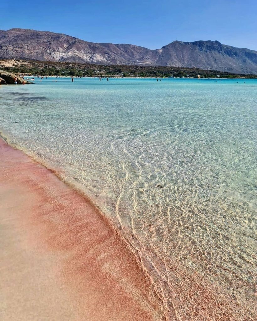 Crystal-clear waters, soft pink sand, and a backdrop of rugged mountains — Elafonissi Beach is a must-stop on any Crete road trip. 