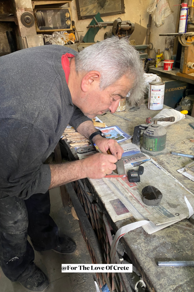 Meet Kyriakos—the man behind O Armenis, one of the most iconic traditional knife shops in Chania, which he runs together with his wife Froso. Here he is engraving a custom inscription onto the blade of the knife we bought—just one of many handmade treasures crafted from olive wood, bone, and horn. His work is a living testament to the timeless crafts in Crete, passed down through four generations.
