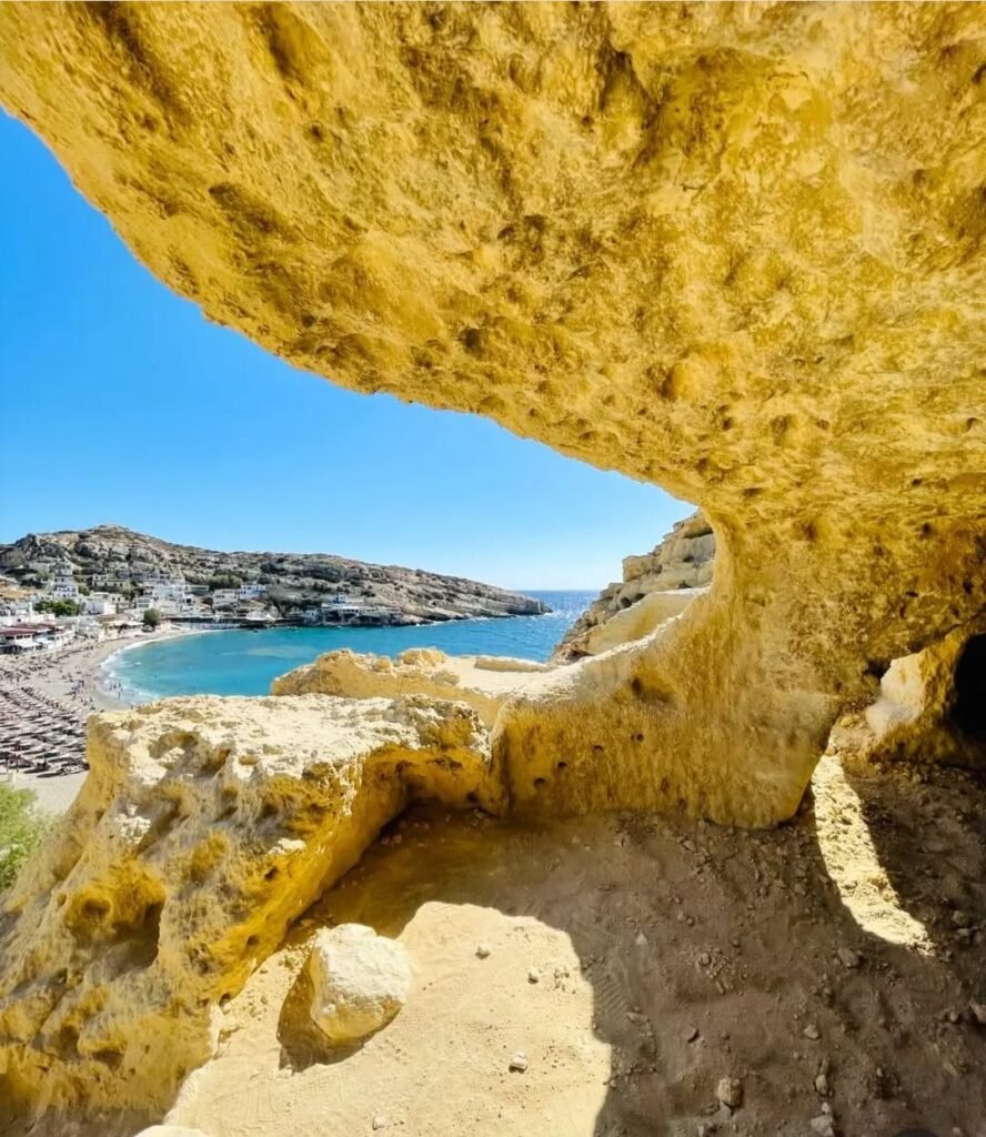 A natural window carved in time — the famous caves of Matala offer a unique view over the bay and the village below.