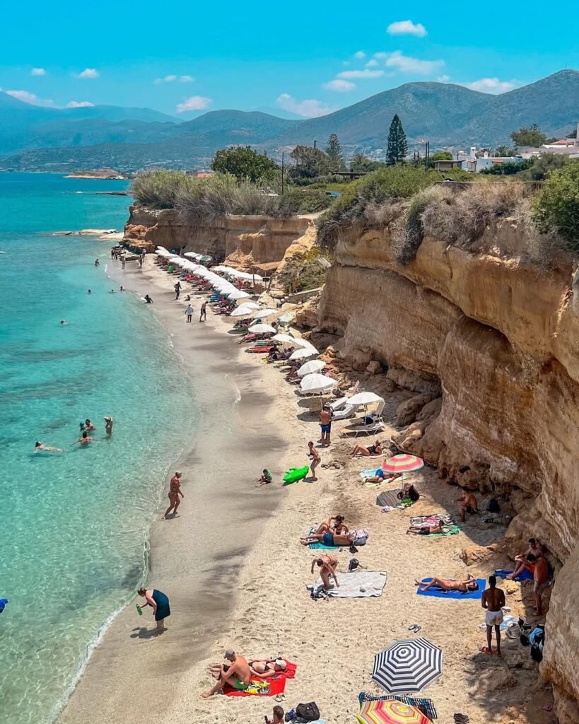 Tucked beneath golden cliffs, Sarandaris Coves offer crystal-clear waters and serene vibes—one of the best beaches near Heraklion for a peaceful escape. 