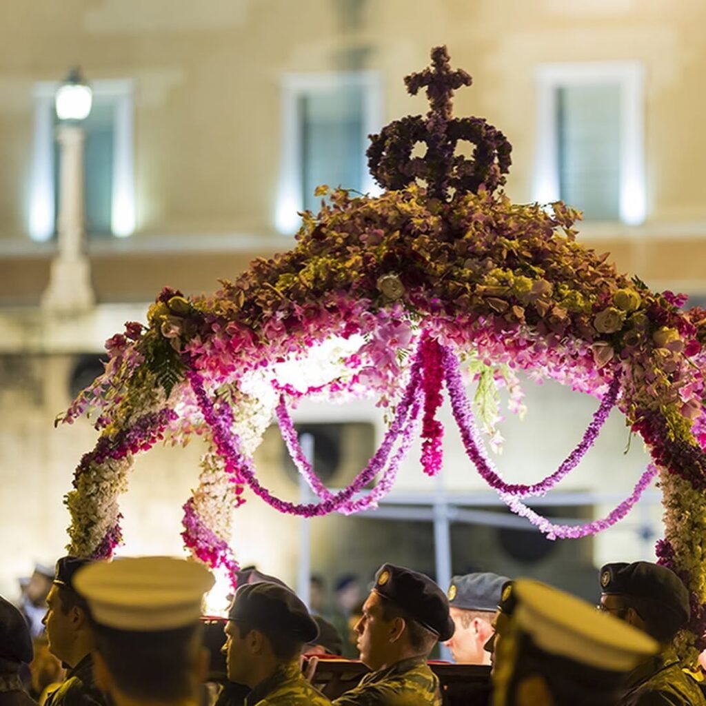 On Good Friday during Orthodox Easter in Crete, the flower-adorned Epitaphios—representing Christ’s tomb—is carried through village streets and city centers in moving candlelit processions filled with reverence and song. 