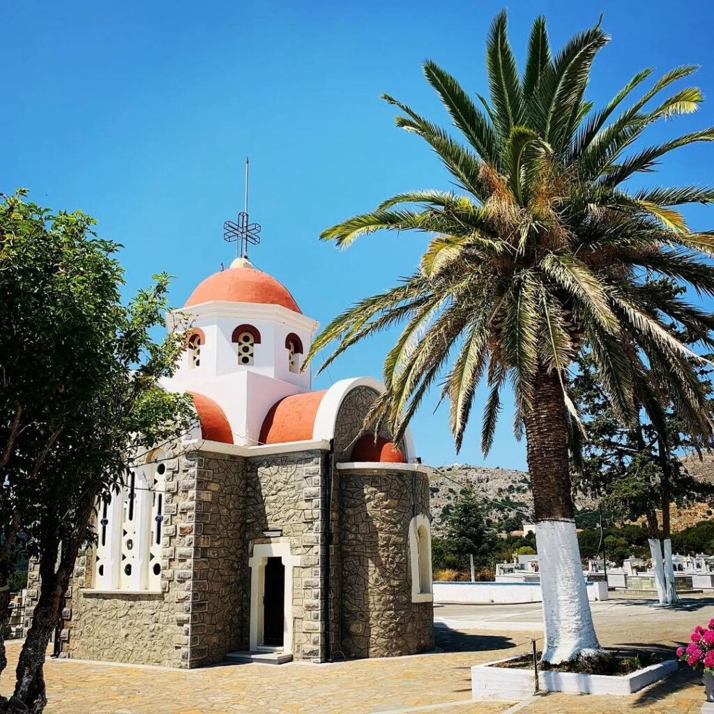 The village of Tzermiado in the Lasithi Plateau is full of charm — like this colourful little church framed by palm trees and mountain views. A peaceful inland stop worth adding to your Crete road trip.