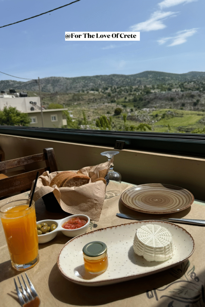 At Arodamos in Anogeia, a light brunch of fresh mizithra cheese with local honey and warm bread—one of the softest brown breads I've ever tasted—is paired with breathtaking mountain views.