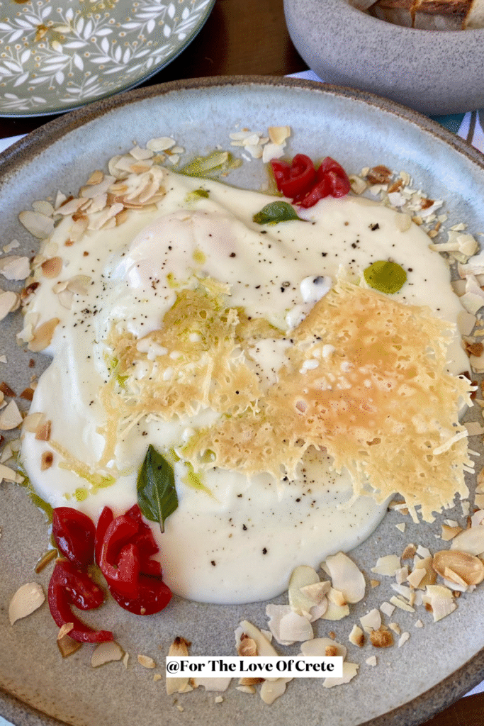 Staka me avga, a traditional Cretan dish of free-range eggs cooked in creamy staka, served at Biolea Astrikas Estate.