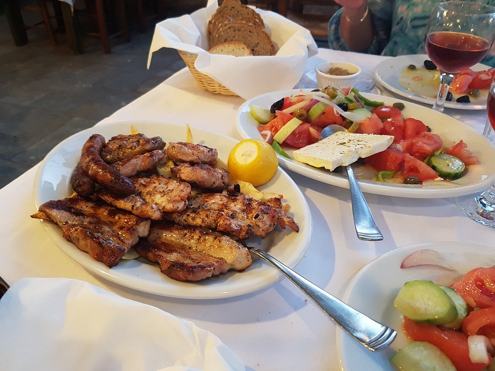 Grilled to perfection and paired with fresh Greek salad—this family-style meal is what makes Bourakis a local favorite.