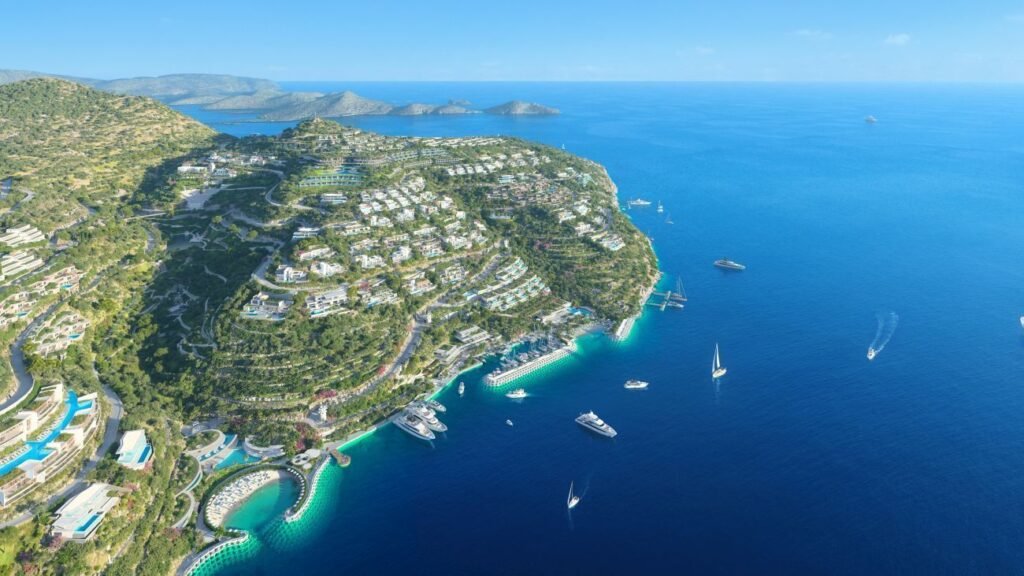 Aerial rendering shows the full scope of the proposed Elounda Hills development, illustrating the extensive transformation planned for this section of Crete's northeastern coastline. Photo Credit: news.gtp.gr