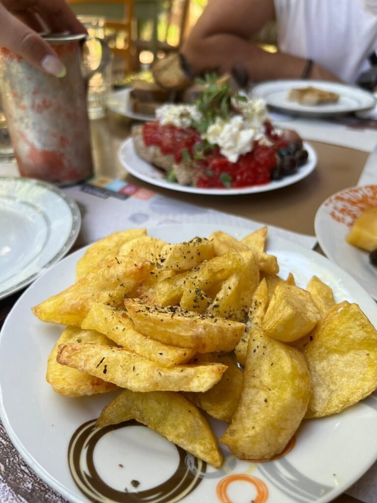 Thick-cut fried potatoes at Ntounias Taverna, served with a sprinkle of Cretan oregano.