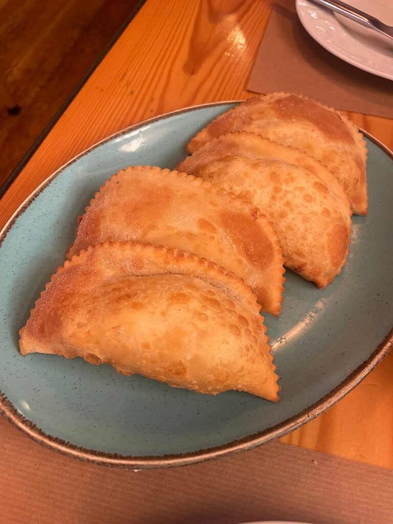 Golden, flaky kalitsounia served fresh at Tamam—one of Chania Old Town’s most beloved and atmospheric restaurants.