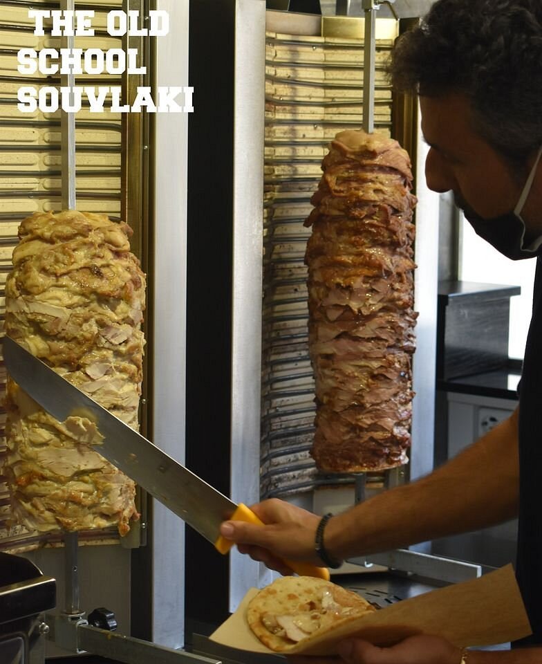 A classic scene at To Souvlaki Opos Palia—gyros carved the old-school way, just as it should be.