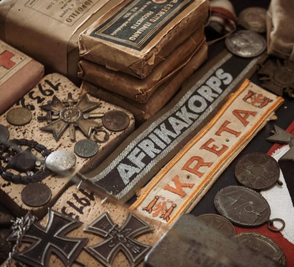 Wartime artifacts at the Askyfou War Museum tell personal stories of Cretan resistance, with medals, coins, and memorabilia preserving the heroic legacy of those who fought for freedom in Crete. 