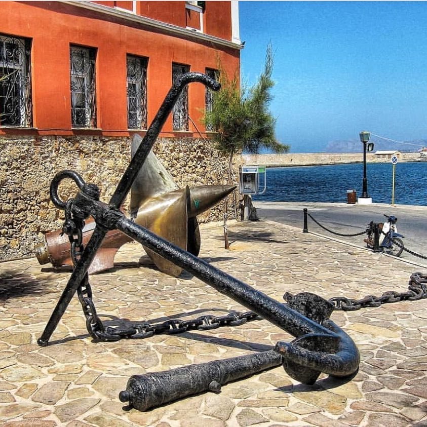 Maritime artifacts displayed outside the Firka Fortress house Chania's Nautical Museum, where centuries of Cretan seafaring history unfolds against the backdrop of the picturesque Venetian harbor. 