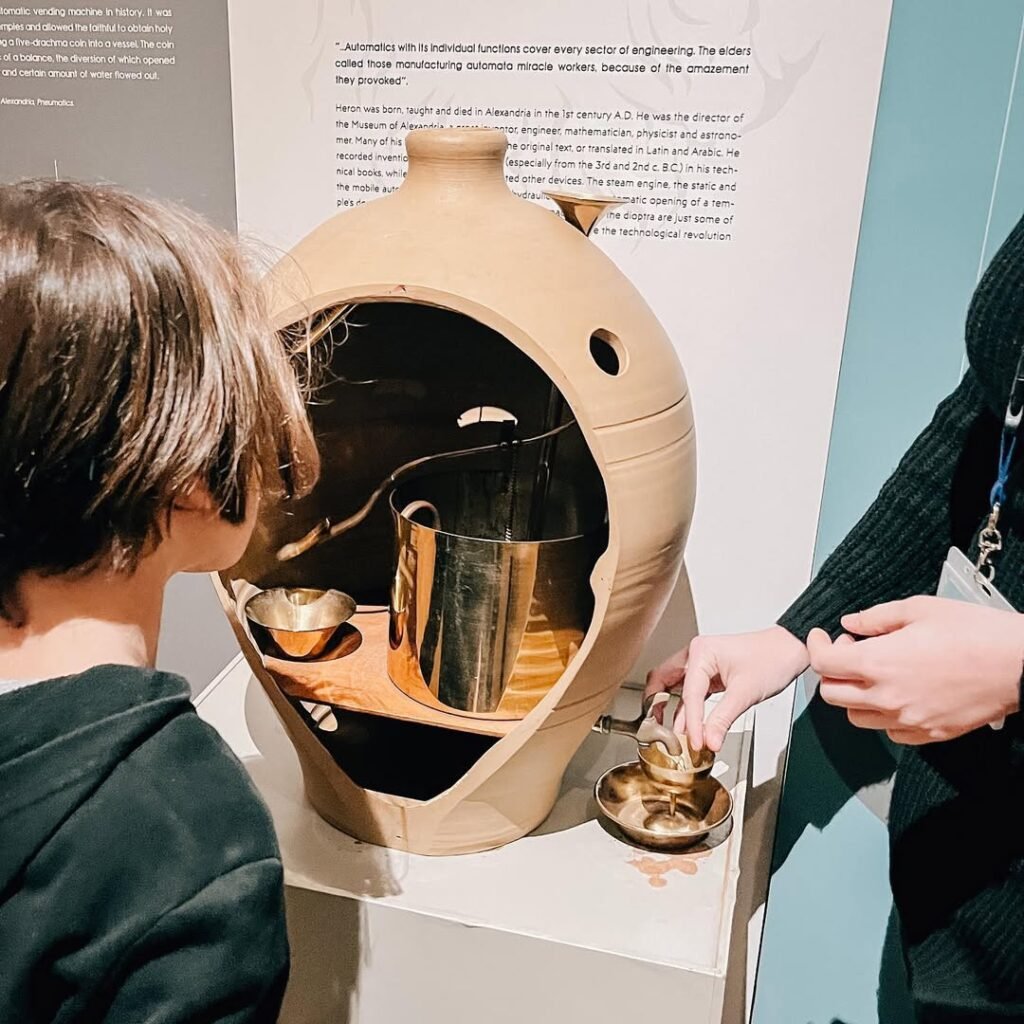 Visitors interact with ancient Greek inventions at the Kostas Kotsanas Technology Museum, where hands-on demonstrations bring 2,000-year-old innovations to life in modern Crete.