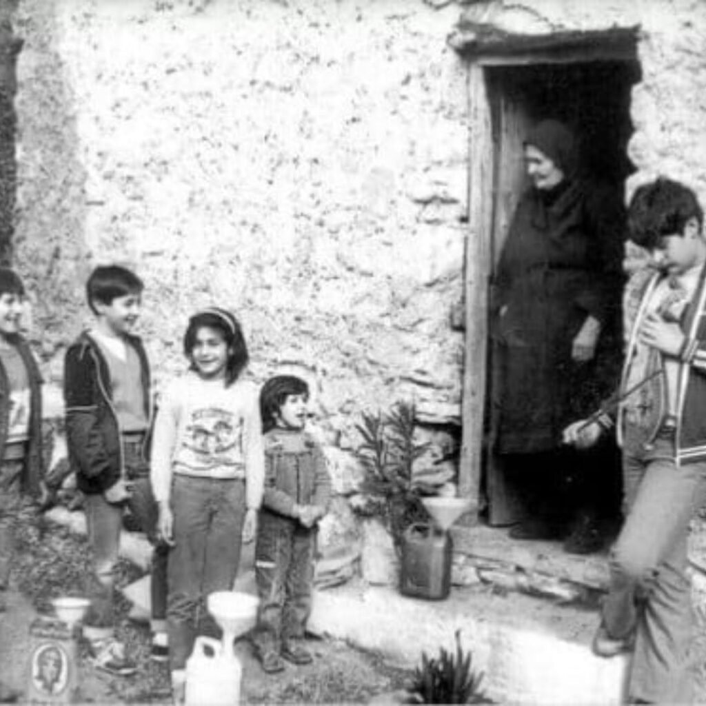 Historic photograph at the Kritsotopoula Museum in Kritsa captures traditional Cretan village life, preserving the cultural heritage that shaped the legendary heroine Rodanthi's world in 19th-century Crete. 