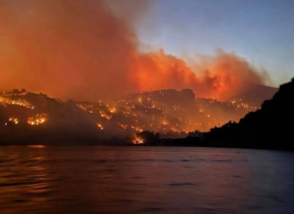 Massive fires illuminate the night sky across southeastern Crete on July 2nd, 2025, as flames spread rapidly through the mountainous terrain near Ierapetra. Photo Credit: Meteo Hellas