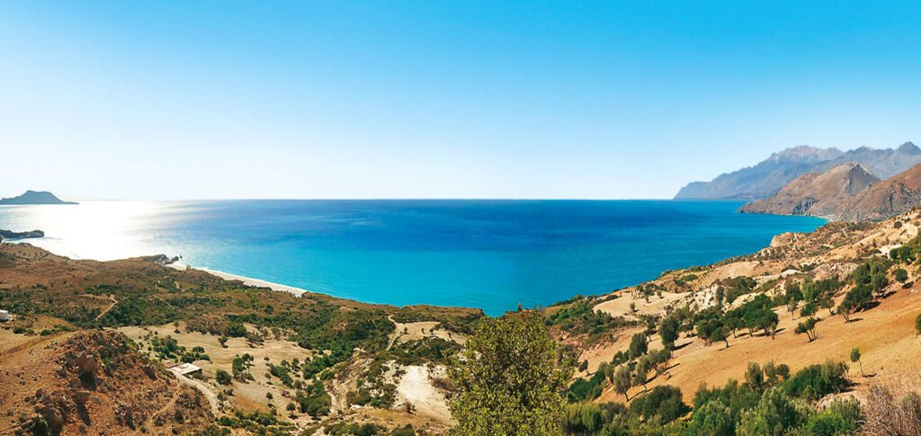 The untouched natural beauty of Triopetra's coastline and surrounding landscape as it exists today, before the planned €500 million resort development transforms this pristine area of south Rethymno into a massive luxury complex. Photo Credit: www.emeralddevelopments.gr