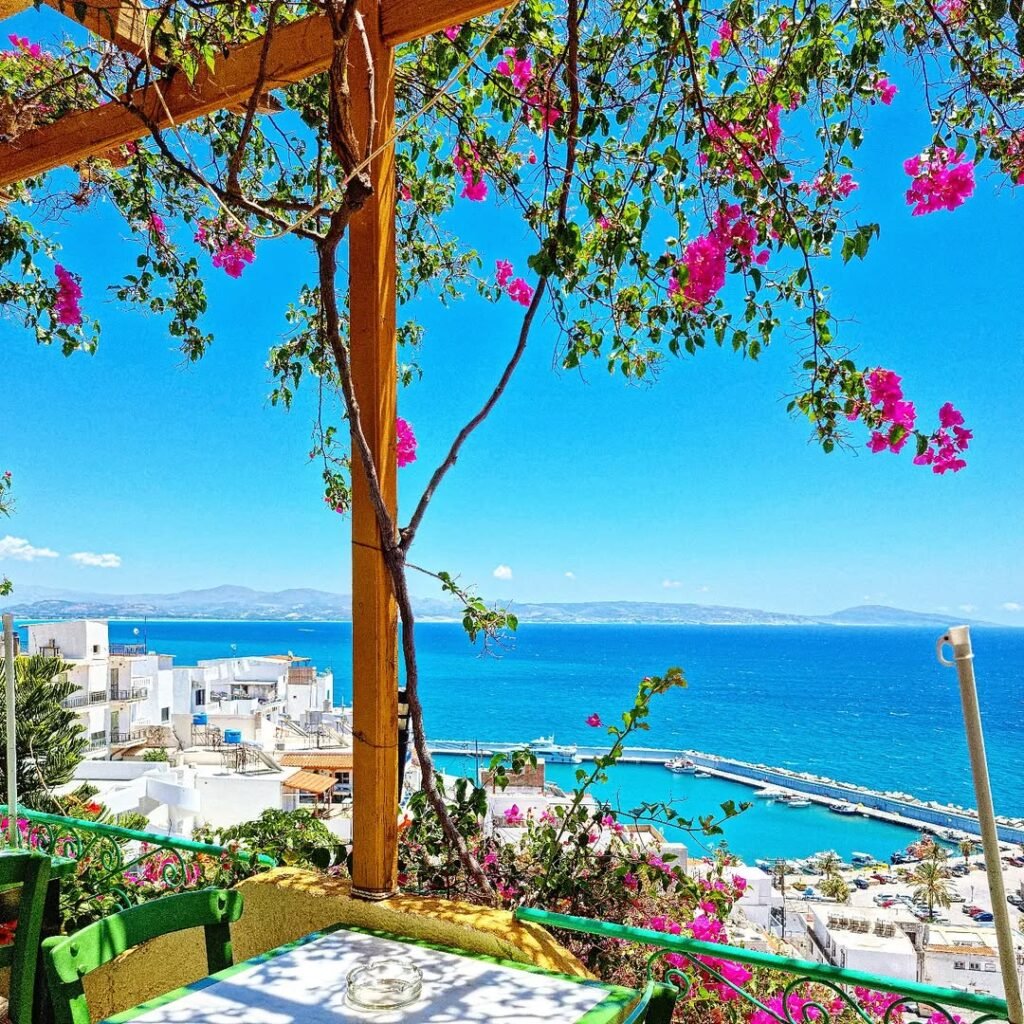 A sun-dappled terrace in Agia Galini overlooking the Libyan Sea, where the ancient Greek prescription of gentle sunshine and sea air becomes part of daily life in southern Rethymno. 
