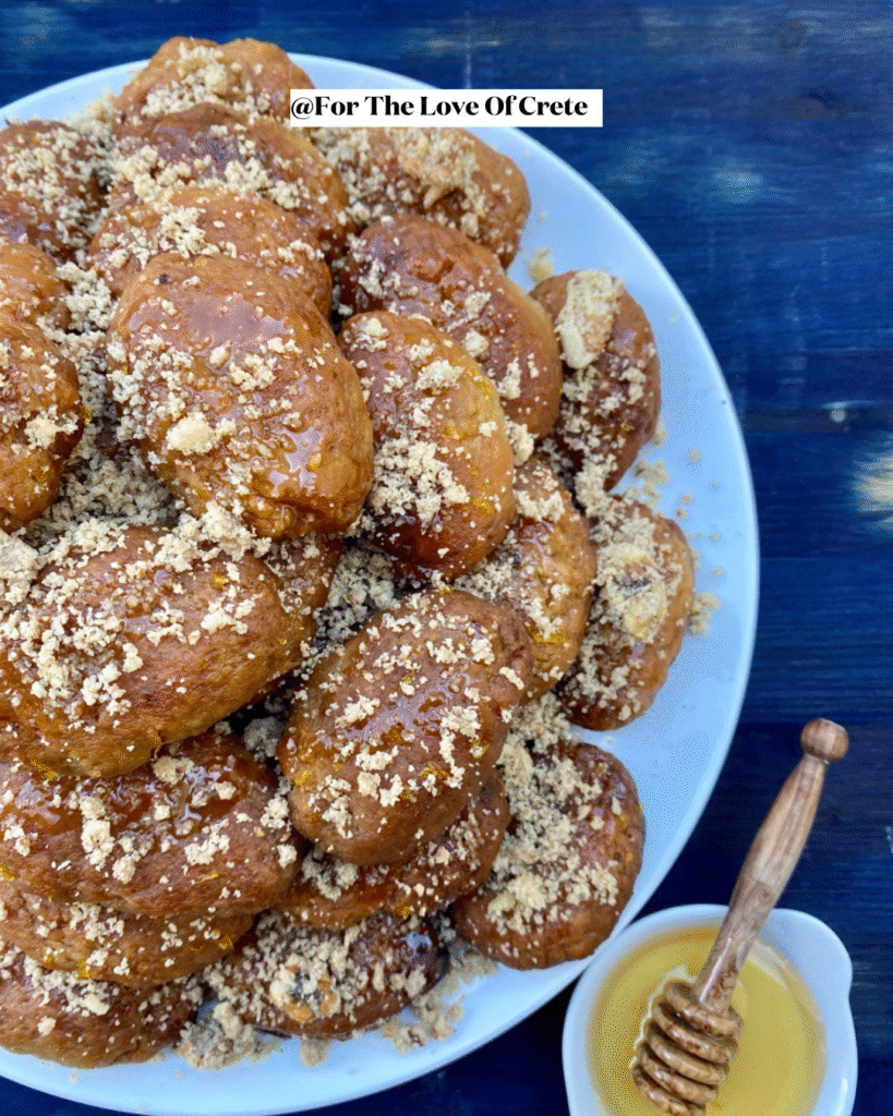 Honey-soaked melomakarona topped with crushed walnuts, capturing the essence of Greek Christmas traditions in every fragrant, spiced bite. 
