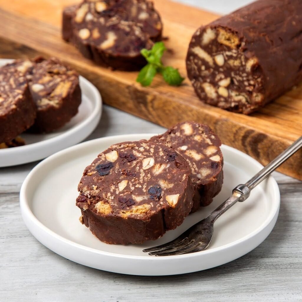 Sliced mosaiko revealing its beautiful mosaic pattern of chocolate and crushed biscuits, creating this beloved no-bake Greek treat. 